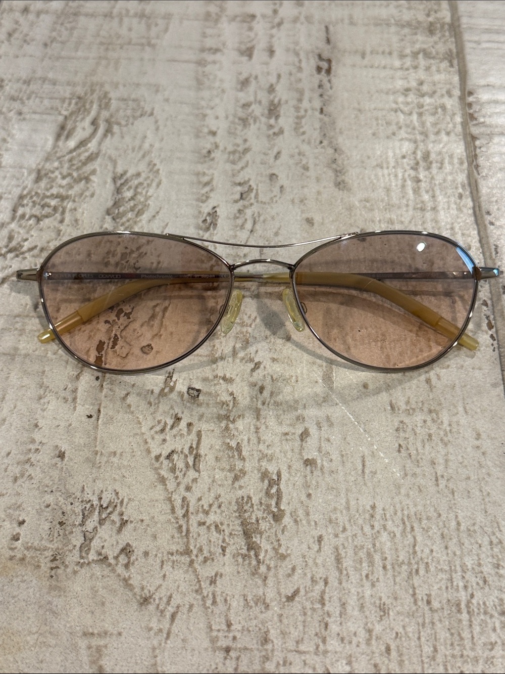 Oliver Peoples Oval Metal Sunglasses with Brown/ pink Lenses and Yellow Temples